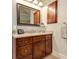 Bathroom vanity features dark wood cabinets, a granite countertop and a mirror at 103 Old Avery Dr, Canton, GA 30115
