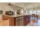 Kitchen with a large island, granite counters, and views to the living room at 103 Old Avery Dr, Canton, GA 30115