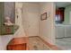 Charming mudroom with storage bench, coat hooks, and a view into the laundry area at 103 Old Avery Dr, Canton, GA 30115