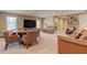 Spacious recreation room with comfortable seating, game table, and a large TV at 103 Old Avery Dr, Canton, GA 30115