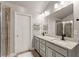 Stylish bathroom showcasing a double vanity, granite countertops, tile flooring, and a glass shower at 3490 Mulberry Cove Way, Auburn, GA 30011