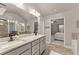 Bright bathroom with double vanity, granite countertops, and a separate shower and bathtub at 3490 Mulberry Cove Way, Auburn, GA 30011