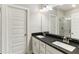 Sleek bathroom with double vanity, modern fixtures, and glass-enclosed shower at 709 Bismark Ne Rd, Atlanta, GA 30324