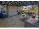 Relaxing backyard with paver patio, comfortable seating, and an outdoor dining area at 2295 Hemrick Rd, Cumming, GA 30041