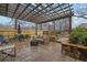 Outdoor patio features stamped concrete, pergola, and a cozy fire pit for relaxing and entertaining at 2295 Hemrick Rd, Cumming, GA 30041