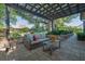 Inviting backyard patio with comfortable seating area surrounded by lush landscaping at 2295 Hemrick Rd, Cumming, GA 30041