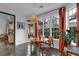 Sunny breakfast nook boasts orange drapes, bright windows, and views of the property's backyard at 2295 Hemrick Rd, Cumming, GA 30041