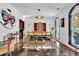 Elegant dining room with stylish furniture, arched windows, and unique decorative elements at 2295 Hemrick Rd, Cumming, GA 30041