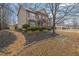 Beautiful home with a brick and siding exterior, complemented by lush landscaping and a stone-lined flowerbed at 2295 Hemrick Rd, Cumming, GA 30041