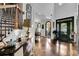 Bright foyer with a staircase, gleaming floors, and an open view into the dining area at 2295 Hemrick Rd, Cumming, GA 30041