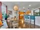 Eat-in kitchen featuring updated appliances, hardwood floors, and eat-in breakfast nook at 2295 Hemrick Rd, Cumming, GA 30041
