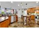 Well-equipped kitchen with wooden cabinets, stainless steel appliances, and a functional center island at 2295 Hemrick Rd, Cumming, GA 30041