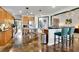 Bright, open kitchen featuring modern appliances, eat-in bar, and open floor plan at 2295 Hemrick Rd, Cumming, GA 30041
