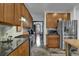 Kitchen boasts ample cabinet space, stainless steel appliances, and refinished concrete floors at 2295 Hemrick Rd, Cumming, GA 30041