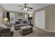 The living room has neutral walls, a ceiling fan, and large windows at 2295 Hemrick Rd, Cumming, GA 30041