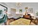 Bright living room featuring a large sectional sofa, accent lighting and modern decor at 2295 Hemrick Rd, Cumming, GA 30041