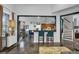 Bright living area featuring a breakfast bar that connects to the kitchen and a staircase leading to the upper level at 2295 Hemrick Rd, Cumming, GA 30041