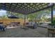 Outdoor patio with dining set, grill, and seating area under a pergola at 2295 Hemrick Rd, Cumming, GA 30041
