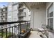 Relaxing outdoor balcony with seating area and views of the building's exterior at 2310 River Green Nw Dr, Atlanta, GA 30327