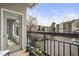 Cozy outdoor balcony featuring seating and pleasant views of the surrounding area at 2310 River Green Nw Dr, Atlanta, GA 30327