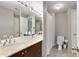 Bathroom featuring a dual sink vanity with marble countertop and a shower with a curtain at 2310 River Green Nw Dr, Atlanta, GA 30327