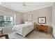 Bright and airy bedroom features a neutral color palette and balcony access at 2310 River Green Nw Dr, Atlanta, GA 30327
