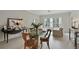 Dining room area featuring a glass table, seating for four, and views to the exterior at 2310 River Green Nw Dr, Atlanta, GA 30327