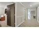 Well-lit hallway with neutral decor and access to apartment 23B at 2310 River Green Nw Dr, Atlanta, GA 30327