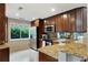 Modern kitchen featuring stainless steel appliances, granite countertops and wood cabinets at 2310 River Green Nw Dr, Atlanta, GA 30327