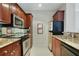 Kitchen featuring stainless steel appliances, sleek black oven, and a tile backsplash at 2310 River Green Nw Dr, Atlanta, GA 30327