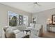 Bright living room with neutral tones, ceiling fan, comfortable seating, and balcony access at 2310 River Green Nw Dr, Atlanta, GA 30327
