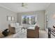 Bright living room with neutral tones, ceiling fan, comfortable seating, and outside view at 2310 River Green Nw Dr, Atlanta, GA 30327