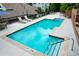 Community pool with lounge chairs and safety features, perfect for relaxation and recreation at 2310 River Green Nw Dr, Atlanta, GA 30327