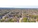 Bird's eye view of homes situated among verdant trees in a quiet, residential area at 9470 Dominion Way, Alpharetta, GA 30022