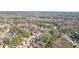 Aerial view of a neighborhood with mature trees and well-maintained homes, offering a peaceful setting at 9470 Dominion Way, Alpharetta, GA 30022