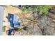 Aerial view highlighting the home's location with an expansive backyard and adjacent stream at 9470 Dominion Way, Alpharetta, GA 30022