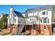Back of the house featuring a two-story deck perfect for relaxing and entertaining at 9470 Dominion Way, Alpharetta, GA 30022