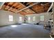 Spacious basement with large windows, utility sink and ceiling fan, perfect for customization and storage at 9470 Dominion Way, Alpharetta, GA 30022