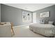 Bedroom with large window and neutral decor at 9470 Dominion Way, Alpharetta, GA 30022