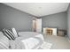Bedroom with neutral carpet, a writing desk, and a bed at 9470 Dominion Way, Alpharetta, GA 30022