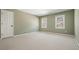 Bedroom with neutral carpet and natural light at 9470 Dominion Way, Alpharetta, GA 30022