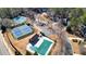 Aerial view showcasing community amenities including tennis courts and a covered swimming pool at 9470 Dominion Way, Alpharetta, GA 30022