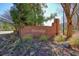 Stone monument for the Hartridge community nestled in landscaping and trees at 9470 Dominion Way, Alpharetta, GA 30022