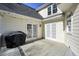 Exterior home view showing an outdoor deck with a grill, with white siding and double doors leading inside at 9470 Dominion Way, Alpharetta, GA 30022