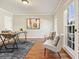Bright office space featuring hardwood floors, a modern desk, and natural light from the windows at 9470 Dominion Way, Alpharetta, GA 30022