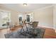 Bright office space with hardwood floors, neutral walls, and a modern desk and french doors at 9470 Dominion Way, Alpharetta, GA 30022