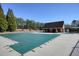 Community pool covered for the off season with a bathhouse and meticulous landscaping at 9470 Dominion Way, Alpharetta, GA 30022