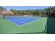 Community tennis courts with vibrant colors and meticulous upkeep at 9470 Dominion Way, Alpharetta, GA 30022