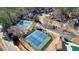 Aerial view of the community tennis courts with meticulously maintained landscaping at 9470 Dominion Way, Alpharetta, GA 30022