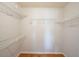 Efficient walk-in closet featuring metal shelving for optimal storage space and organization solutions at 9470 Dominion Way, Alpharetta, GA 30022